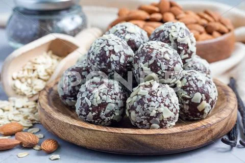 Healthy homemade paleo chocolate energy balls on wooden plate, horizontal Stock Photos