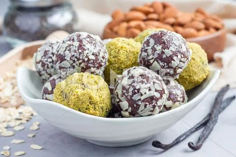 Healthy homemade paleo chocolate energy balls on plate, horizontal Stock Photos