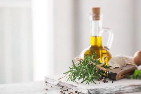 Healthy ingredients on a kitchen table - spaghetti, olive oil, tomatoes, sp.. Stock Photos