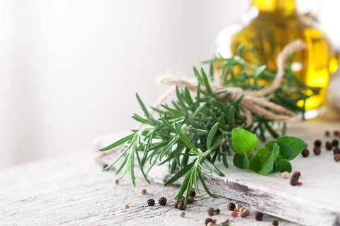 Healthy ingredients on a kitchen table - spaghetti, olive oil, tomatoes, sp.. Stock Photos