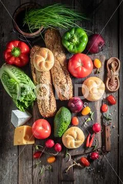 Healthy ingredients for sandwich with vegetables, cheese and herbs Stock Photos
