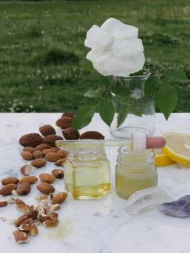 Healthy living, elements to make pruning for pains. Almonds, Beeswax, a dropp Stock Photos