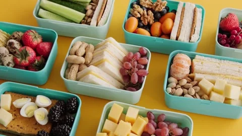 Healthy Lunch Boxes with Yellow Background. Stock Footage 305808543