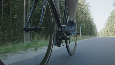 Healthy man doing exercise riding a bicycle in nature Stock Footage 74559530