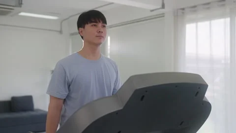 Healthy man Running on Treadmill Stock Footage 248584816
