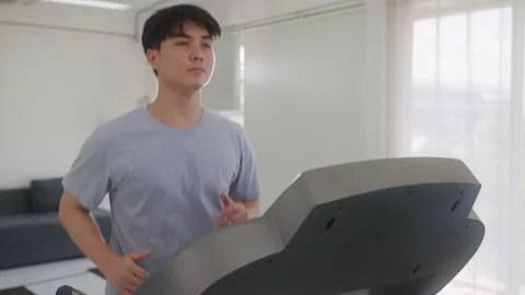 Healthy man Running on Treadmill Video stock 248584943