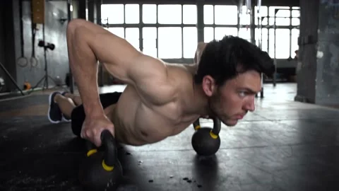 Healthy man training push ups exercise intense muscle workout in gym Stock Footage 131218091