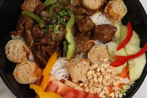 Healthy meal asian bobun salad with beef and nems Stock Photos