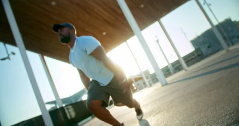 Healthy mixed race active guy exercising outdoors at urban landscape morning Stock Footage 140739911