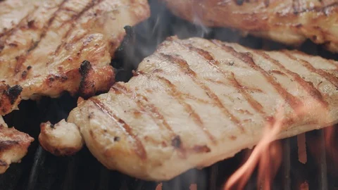 Healthy Organic Chicken Breast Cooking on a Flame Grill Stock Footage