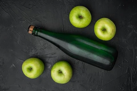 Healthy organic food. Apple cider vinegar, on black dark stone table backgrou Stock Photos