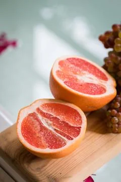 Healthy Organic Red Ruby Grapefruit on wooden background Stock Photos
