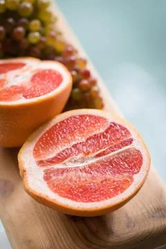 Healthy Organic Red Ruby Grapefruit on wooden background Stock Photos