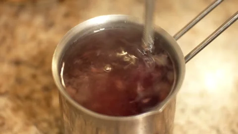 Healthy raspberry tea - raspberry jam is added to hot water Stock Footage 305595375