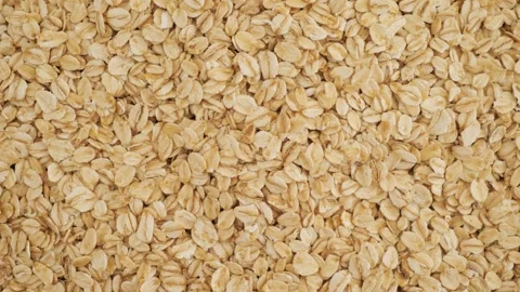 Healthy raw rolled oats rotating for breakfast Stock Footage 337011717