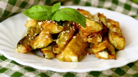 Healthy roasted zucchini served with basil on rustic background Stock-Footage 342520792