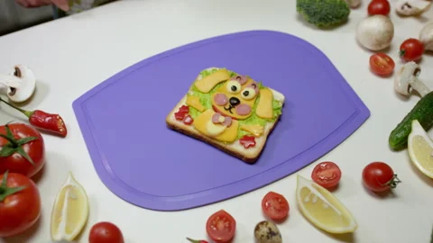 Healthy sandwich in dog shape with vegetable and cheese Stock Footage 229843961