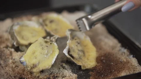 Healthy seafood, closeup serving open oysters with cheese right from the oven 스톡 동영상 91201113