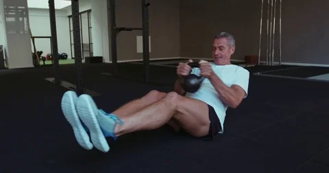 Healthy senior man working out in gym Stock Footage 79486130