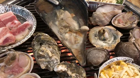 Healthy shellfish grilling on the charcoal Stock Footage 70374337