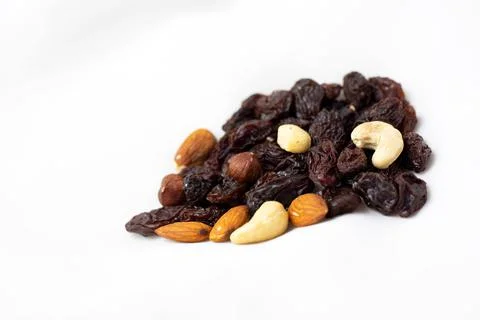 A healthy snack of a mixture of nuts and raisins Stock Photos