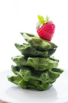 Healthy Spinach Waffle Stack with Strawberry Garnish for Breakfast Stock Photos
