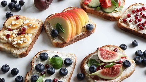 Healthy summer toasts for breakfast Stock Footage 91019574