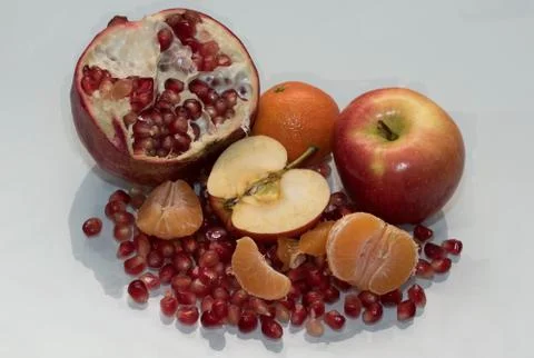 Healthy sweet apple garnet and mandarin Stock Photos