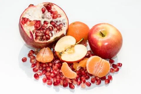 Healthy sweet apple garnet and mandarin Stock Photos