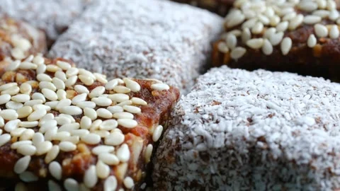Healthy vegan raw sweets with dates and nuts Stockbeeldmateriaal 337830787