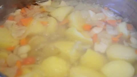 Healthy vegetable soup boiling in a pot during cooking Stock Footage 320198793