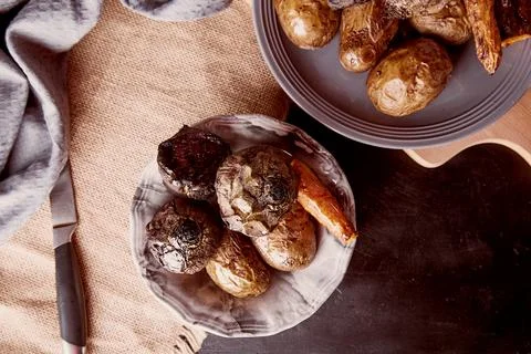Healthy vegetables on rustic background - baked carrots, potatoes, beetroot Stock Photos