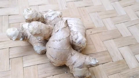 Healthy Whole Ginger Roots Displayed on Bamboo Mat Stock Footage 340538241