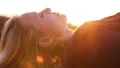 Healthy woman relaxing at sunset HD Footage