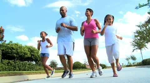 Healthy Young Ethnic Family Jogging Together Stock Footage