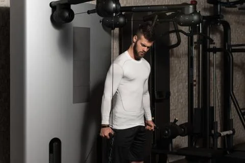 Healthy Young Man Doing Exercise For Biceps Foto stock