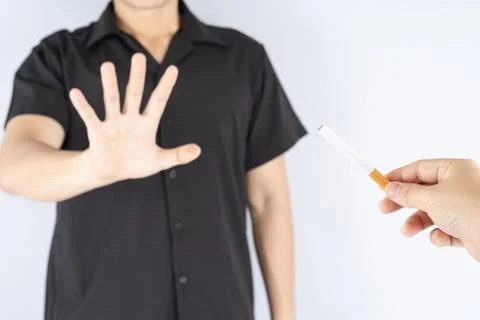 Healthy young man refusing to take cigarette quit of smoking concept. Tobacco Stock Photos