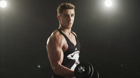 Healthy young man training his right biceps Stock Footage 68492907
