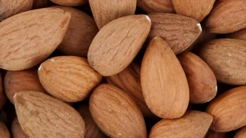 Heap of almonds rotating on the table Stock Footage 134949284