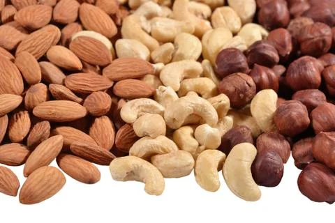 Heap of assorted nuts on a white Stock Photos