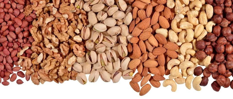 Heap of assorted nuts on a white Stock Photos