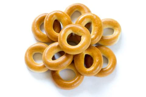 Heap of baked dry bagels on white background Stock Photos