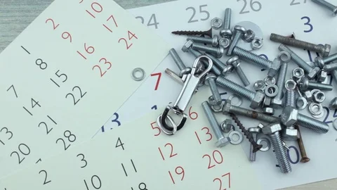 Heap of bolts on calendars Stock Footage 86723033