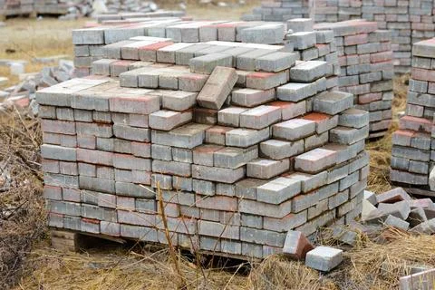 Heap of Bricks Stack of calcium silicate bricks on a construction site Cop... Stock Photos