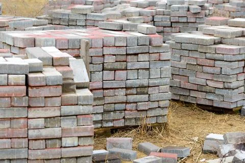 Heap of Bricks Stack of calcium silicate bricks on a construction site Cop... Stock Photos