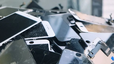 Heap of Broken iPhone display screens of a used smartphones. Mobile phone. Edito Stock Footage 125065198