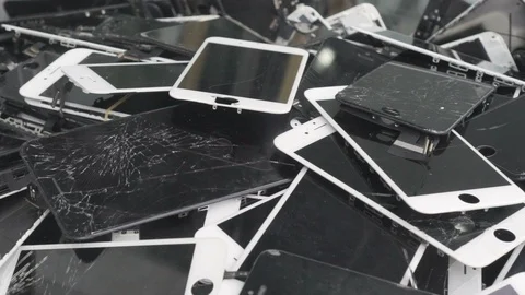 A heap with the broken iphone screens lying one on top of another. Devices Stock Footage 97823562