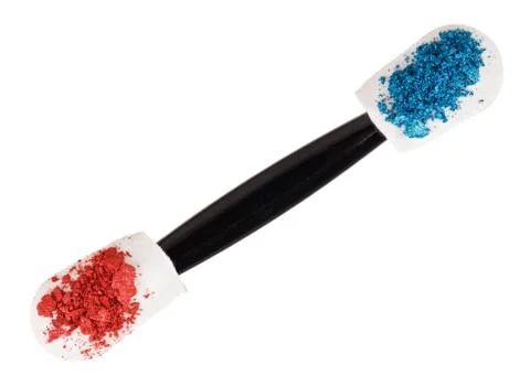 Heap of broken multicolor eyeshadow over makeup sponge, isolated on white mac Fotos Stock