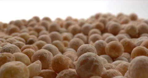 Heap of brown peas on white background. Contains a lot of carbohydrates Stock Footage 148925243