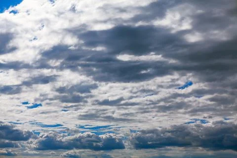 Heap of clouds with sun rays Stock Photos
